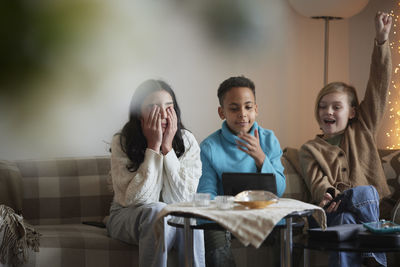 Children playing video games at home