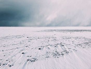 View of frozen sea against sky