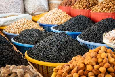 View of colorful sweets and nuts on showcase of local food market, uzbekistan	
