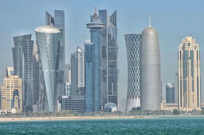 Modern buildings in city against sky