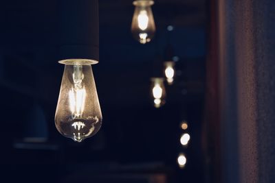Close-up of illuminated light bulb