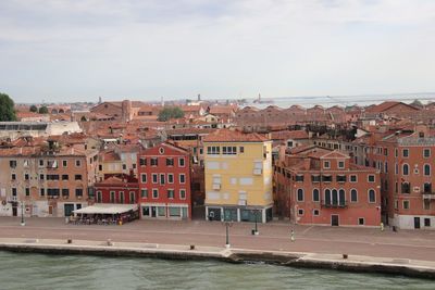 Townscape by sea against sky