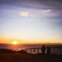 Scenic view of sea at sunset