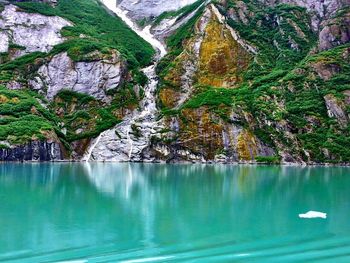 Scenic view of sea with mountain in background