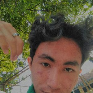 Portrait of young man against plants