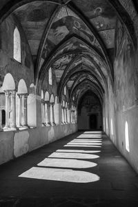 Rear view of man walking in tunnel