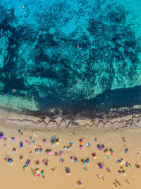 High angle view of people swimming in sea
