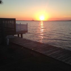 Scenic view of river against sky during sunset