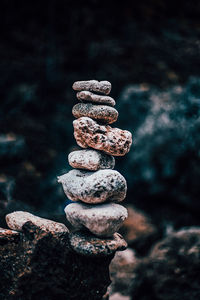 Close-up of stone stacked on rock