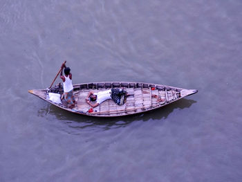 High angle view of people on boat sailing in sea