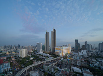 Buildings in city against sky