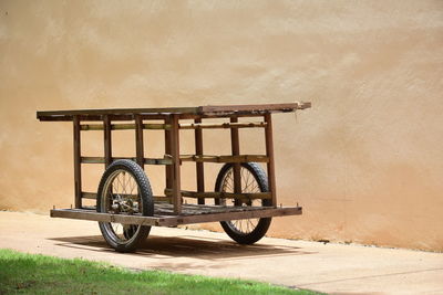Bicycle parked against wall