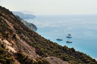 High angle view of boats in sea against clear sky