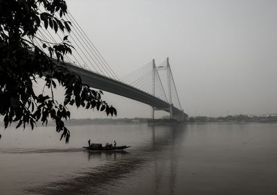 Bridge over river against clear sky