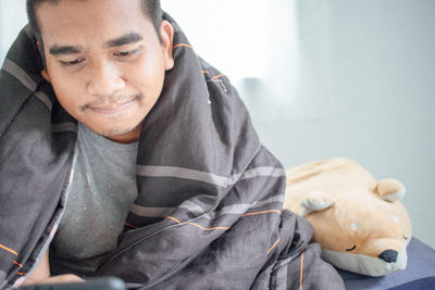 Portrait of young man sitting outdoors