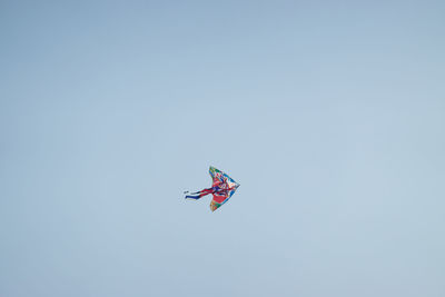 Low angle view of kite flying in sky