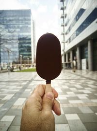 Cropped hand holding ice cream