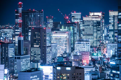 Illuminated buildings in city at night