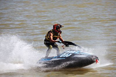 Man surfing on boat in sea