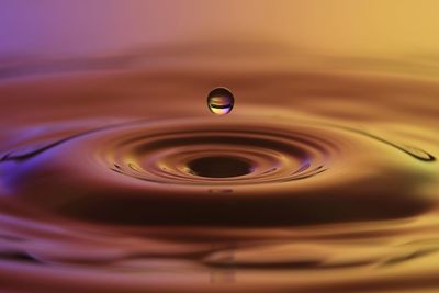 Close-up of drop falling in water