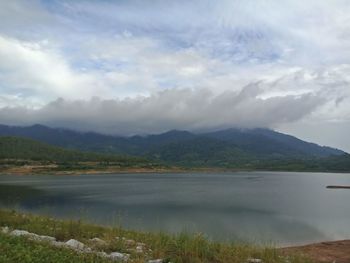 Scenic view of lake and mountains against sky