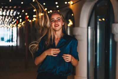 Full length of woman standing at night