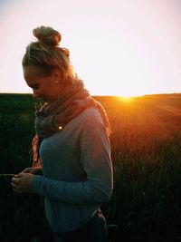 Woman standing on grassy field