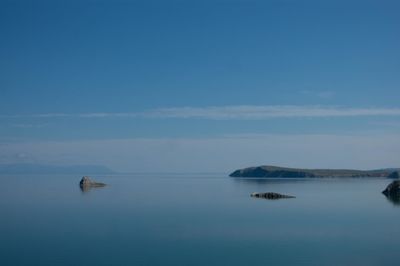 Scenic view of sea against blue sky