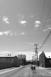 Cars on road against sky