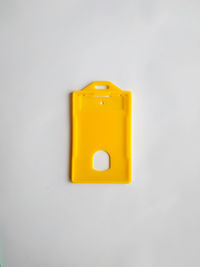 Close-up of yellow light over white background