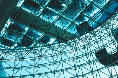 Low angle view of glass ceiling in building