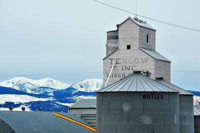 Building against sky during winter