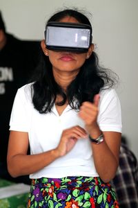 Woman using virtual reality simulator
