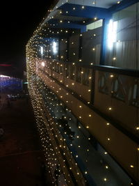 Illuminated walkway at night