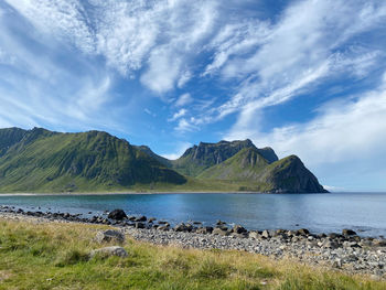 Scenic view of sea and mountains against sky in lofoten 