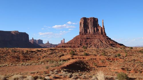 View of rock formations on landscape against sky