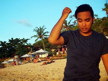 Man on beach against sky