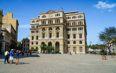 Group of people walking in building