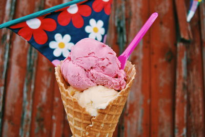 Close-up of spoon stuck in ice cream cone