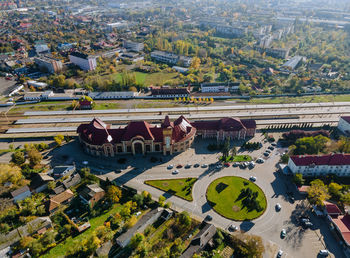 High angle view of trees and buildings in city