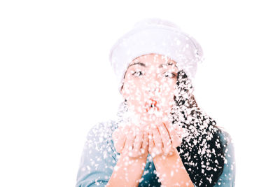 Portrait of woman against white background