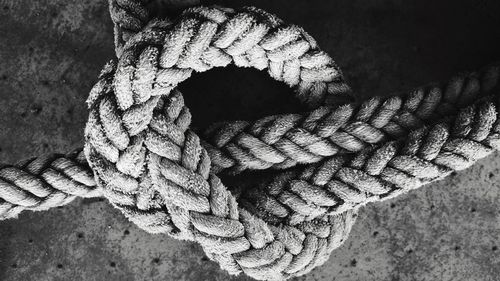 Close-up of tied rope on floor