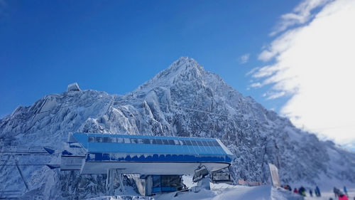 Ski lift station against mountains