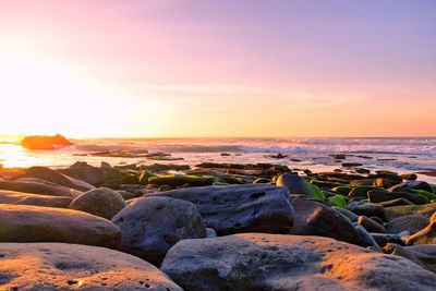 Scenic view of sea against sky during sunset