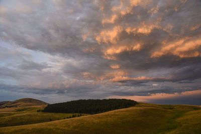 Scenic view of landscape against sky during sunset