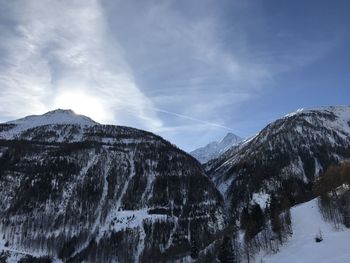 Scenic view of mountains against sky during winter