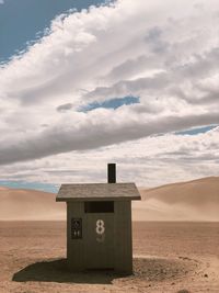 Built structure on beach against sky