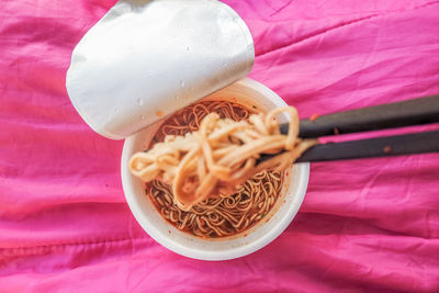 High angle view of pasta in container on table