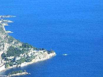 Scenic view of sea against blue sky