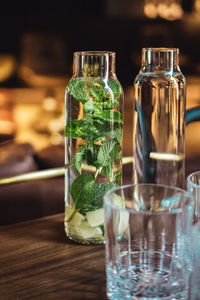 Close-up of wine glasses on table